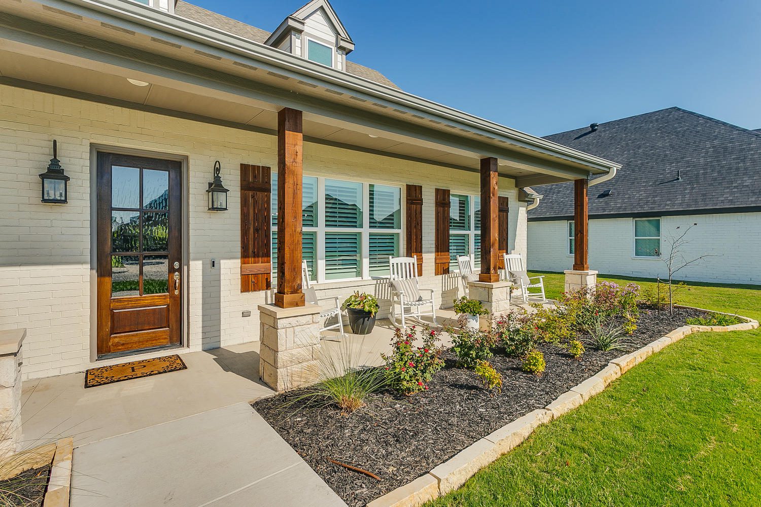 front garden of a house with chairs